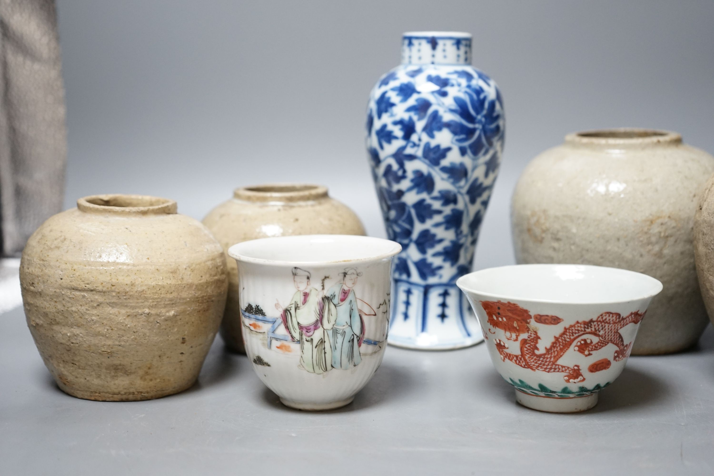 A Chinese blue and white vase, Xuande mark, c.1900, two late 19th Century Chinese cups and four Chinese provincial earthenware jars 19cm